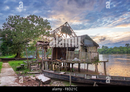 Old run down shack on the Javari River in the Amazon rain forest in Brazil Stock Photo