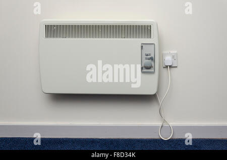 Electric room heater on a wall Stock Photo