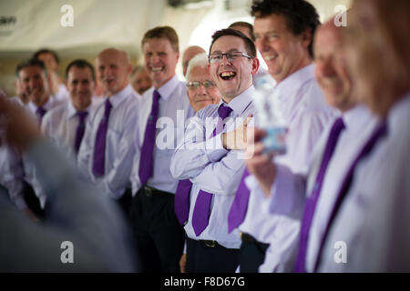 A male voice choir rehearsing before competing at The National Eisteddfod of Wales , held near Meifod village in Powys, mid Wales, August 2015 Stock Photo