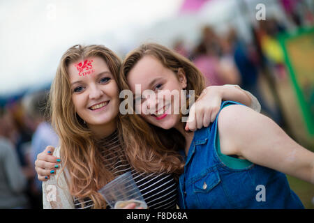 Young teenage girls  enjoying themselves at The National Eisteddfod of Wales , held near Meifod village in Powys, mid Wales, August 2015 Stock Photo