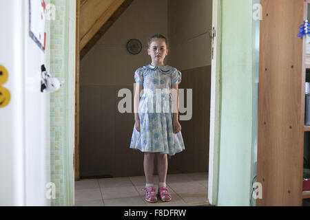 Jurga, Western Siberia, Russia. 8th June, 2015. A girl at the Child center 'Happy kids'. Caritas opened the center ten years ago. About 20 russian catholic, orthodox and buddhist children (aged 5-16) tend to attend several courses such as Russian language to prepare public school, ethic, cooking and theatre. Two pedagogists and five social workers look after them, the social workers cooperate very closely with the public school. Some children need psicological support to deal with family problems such as poverty and alcohol. Some families live in a tiny room with three or four children. Cari Stock Photo