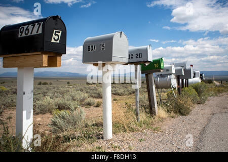 Vintage mailboxes in a row along the road in Arizona Stock Photo