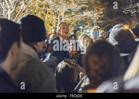 New York, New York, USA. 08th Dec, 2015. Hundreds of fans of the late Beatle, John Lennon gather in the Strawberry Fields section of Central Park on Tuesday, December 8, 2015 to memorialize the 35th anniversary of Lennon's death.  Lennon was shot outside his home in the Dakota Apartments by crazed gunman Mark David Chapman. The fans included people who remembered where they were on that night and many younger people who are not old enough to remember Lennon, a lasting tribute to his music. Credit:  Richard Levine/Alamy Live News Stock Photo