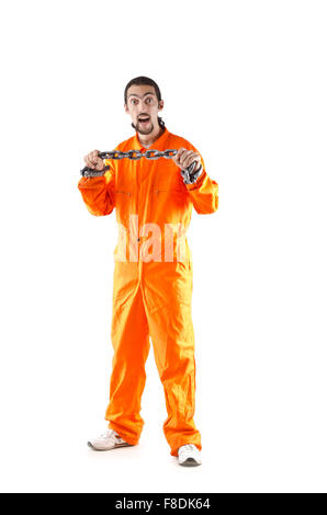 Criminal in orange robe in prison Stock Photo