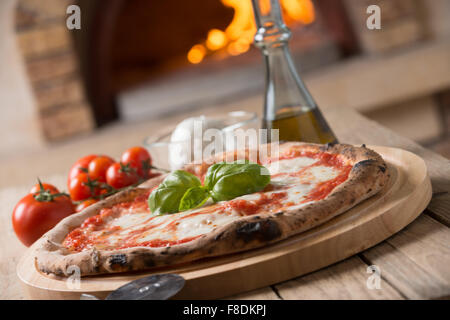 Wood oven baked italian pizza margherita Stock Photo