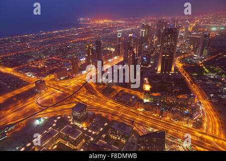Dubai night skyline. Dubai streets by night. Al Yaqoub tower Dubai. Dubai Millennium Plaza. Dubai Sheikh Zayed Road by night. Du Stock Photo