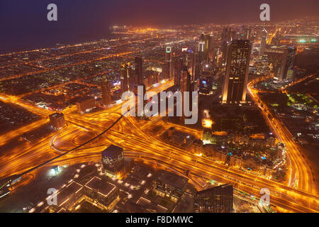 Dubai night skyline. Dubai streets by night. Al Yaqoub tower Dubai. Dubai Millennium Plaza. Dubai Sheikh Zayed Road by night. Du Stock Photo