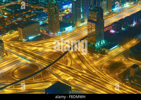 Dubai night skyline. Dubai streets by night. Al Yaqoub tower Dubai. Dubai Millennium Plaza. Dubai Sheikh Zayed Road by night. Du Stock Photo