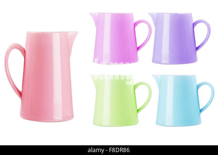 Colourful Ceramic Pitchers on White Background Stock Photo