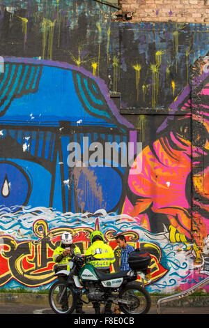 Police control and graffiti, street art in Bogota, Colombia Stock Photo