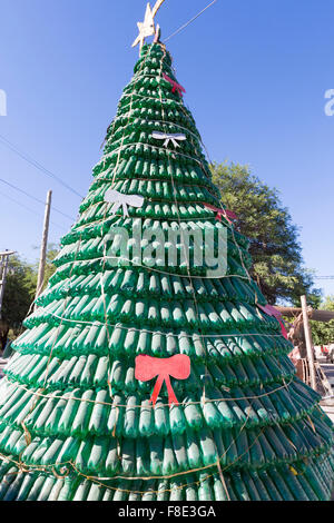 Christmas tree made of green plastic recycled bottles against a clear blue sky near Cafayate in Salta Province. Argentina 2014 Stock Photo
