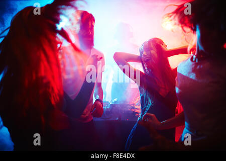 Young people dancing in nightclub Stock Photo