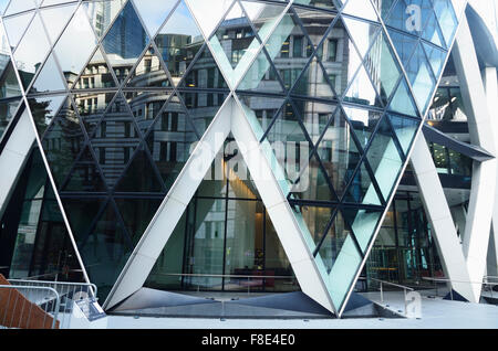30 St Mary Axe (widely known informally as The Gherkin and previously as the Swiss Re Building) is a commercial skyscraper Stock Photo