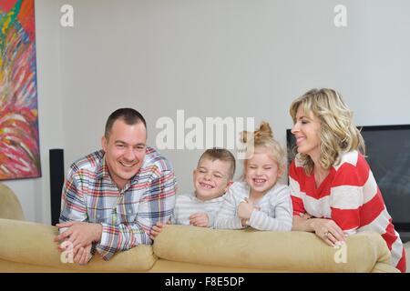 hapy young family have fun  with their children at modern living room home indoors Stock Photo