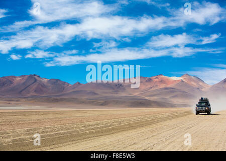 Off-road vehicle driving in the Atacama desert, Bolivia Stock Photo