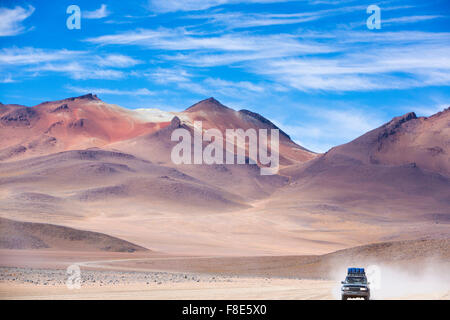 Off-road vehicle driving in the Atacama desert, Bolivia Stock Photo