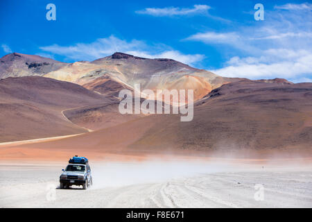 Off-road vehicle driving in the Atacama desert, Bolivia Stock Photo