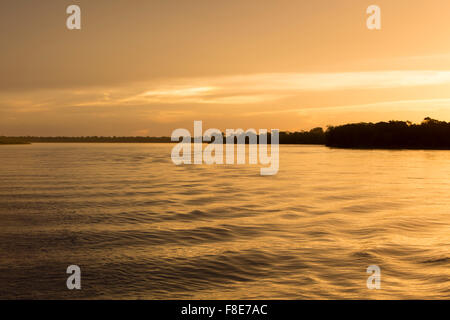 Colorful sunset on the river Amazon in the rainforest, Brazil Stock Photo