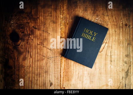 Holy Bible on old wooden church table, top view Stock Photo