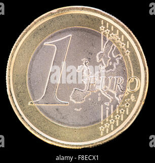 Common side of one euro coin isolated on a black background. The reverse face displays a map of Europe and was designed by Luc L Stock Photo