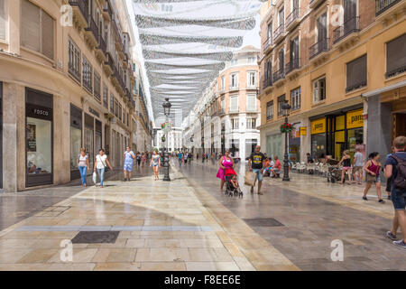 Malaga, Spain-August 31st 2015: People shopping on Marques de Larios. This is the main shopping street in Malaga. Stock Photo