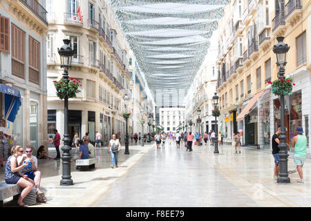 Malaga, Spain-August 31st 2015: People shopping on Marques de Larios. This is the main shopping street in Malaga. Stock Photo