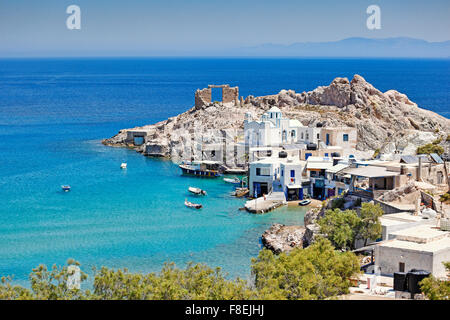 Traditional fishermen houses with the impressive boat shelters, also known as “syrmata” in Firopotamos of Milos, Greece Stock Photo