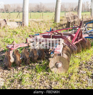 Tool for agriculture: disc harrow used to cultivate the soil. Stock Photo