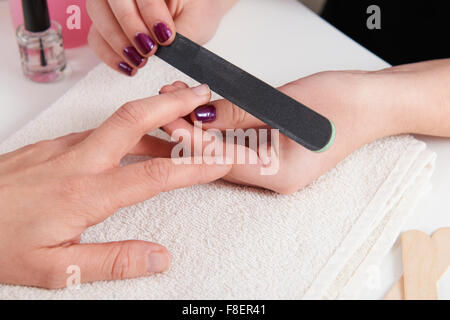 Woman Having Manicure In Beauty Salon Stock Photo