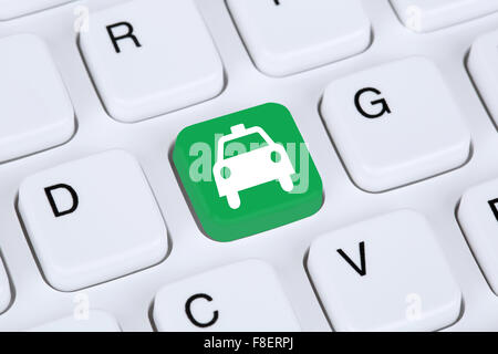 Book a taxi or cab online internet booking computer Stock Photo