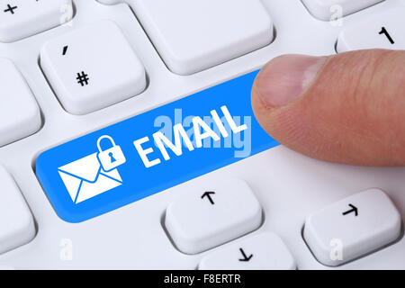 Sending encrypted E-Mail email protection secure mail via internet on computer with letter symbol Stock Photo