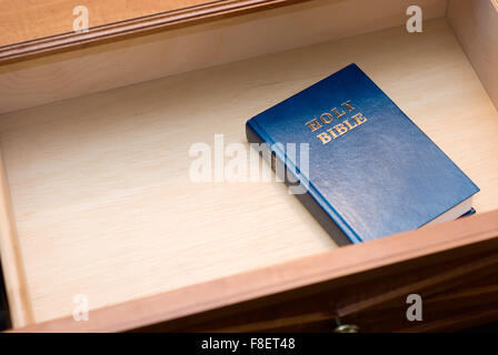 Holy Bible in a hotel room nightstand open drawer with copy space for adding text Stock Photo