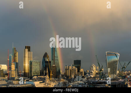 London, UK. 8th December, 2015. A vivid double rainbow arcing over the skyscrapers in the City of London as a powerful rain storm sweeps through the British capital. Credit:  Gary Eason/Alamy Live News Stock Photo
