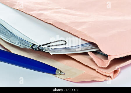 Closeup of envelope with documents and pen on the desk in the office Stock Photo