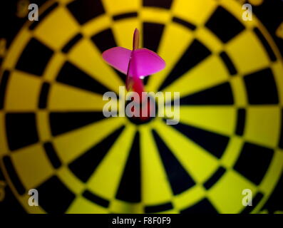 Dart in bullseye Stock Photo