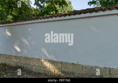 Stone wall covered with tile in Razgrad town, Bulgaria Stock Photo