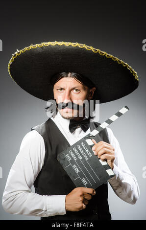 Mexican man wears sombrero isolated on white Stock Photo