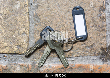 plastic keychain on the floor Stock Photo - Alamy