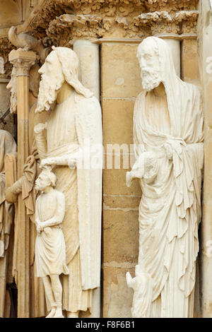 Stone sculptures on the facade of the cathedral Notre-Dame de Reims, France Stock Photo