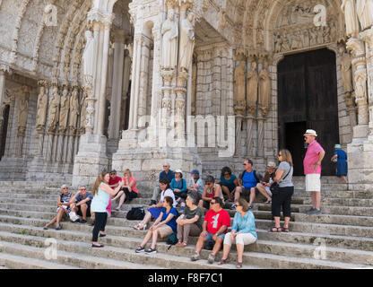 Group of visitors with a tour guide on the steps of Chartres cathedral,  Eure-et-Loir, France, Europe Stock Photo