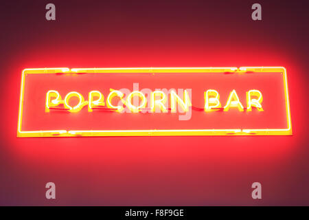 plate popcorn made from red neon lights on the wall Stock Photo