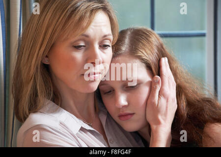 Mother Comforting Teenage Daughter Stock Photo