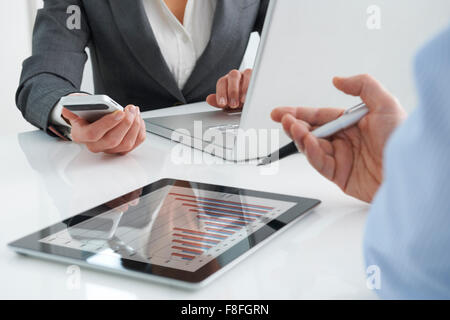 Business Meeting Using Digital Tablet, Laptop And Mobile Phone Stock Photo