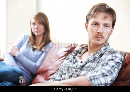 Couple With Relationship Difficulties Sitting On Sofa Stock Photo