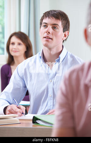Young Man In Adult Education Class Stock Photo