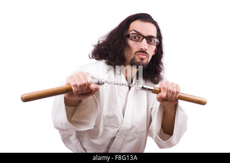 Karate man with nunchucks isolated on white Stock Photo