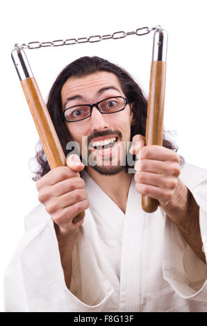 Karate man with nunchucks isolated on white Stock Photo