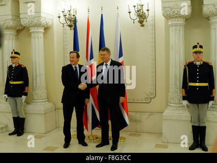 Bucharest, Romania. 9th Dec, 2015. British Prime Minister David Cameron (L) and Romanian President Klaus Iohannis shake hands during a welcome ceremony at Cotroceni Presidential Palace, Bucharest, capital of Romania, Dec. 9, 2015. The European Union (EU) is stronger with Britain inside it and Britain is stronger inside the EU, Romanian President Klaus Iohannis said Wednesday after meeting with visiting British Prime Minister David Cameron. Credit:  Cristian Cristel/Xinhua/Alamy Live News Stock Photo