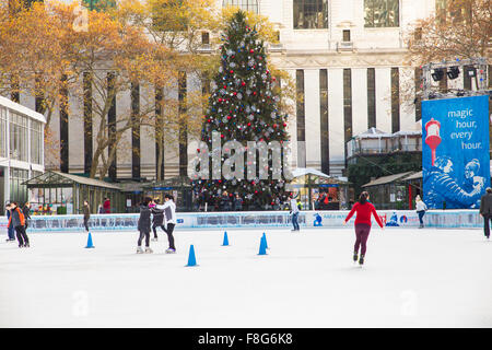 View of Citi Pond ice skating rink at Bryant Park in Manhattan with Christmas Tree on display Stock Photo