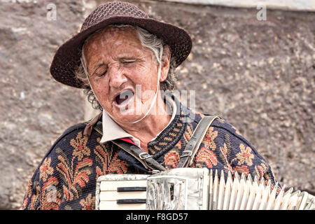 Woman playing accordion in the Historical Center, Quito, Ecuador Stock Photo